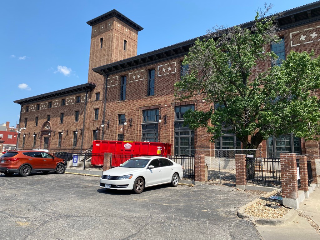 The former Kansas City Star building with two cars in front of it