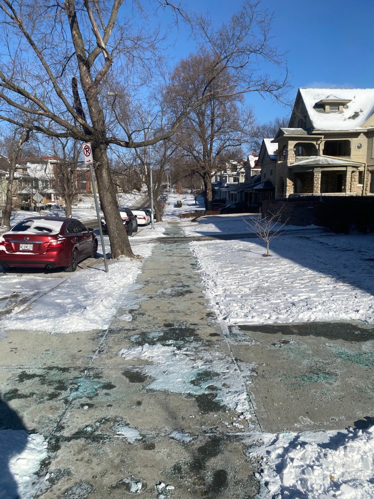 Photo showing Warwick Boulevard in Kansas City on a snowy day. The former boardinghouse Hemingway stayed at is on the right