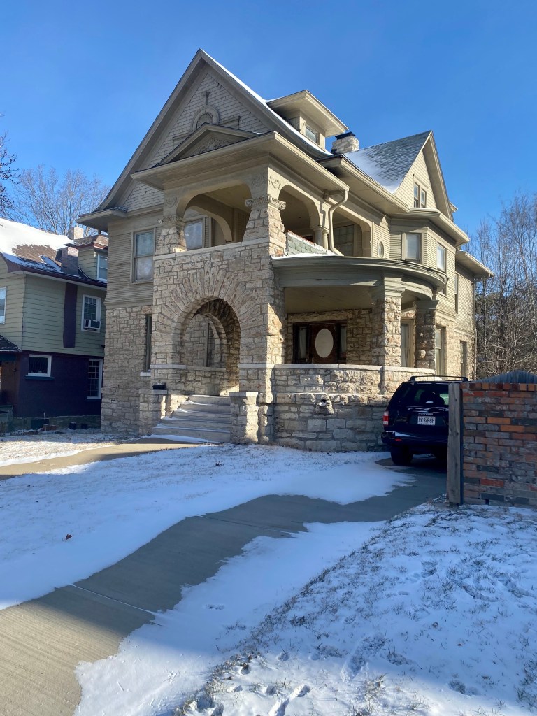 Photo of the stone mansion on Warwick Boulevard in Kansas that was once a boardinghouse run by Mrs Haynes. Photo taken in winter, with snow on the ground