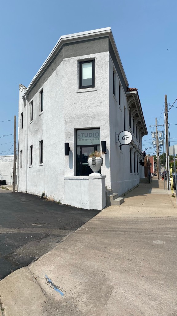 Photo of the Hemingway Building with the word Studio on one of the windows. The Hemingway Building was home to AWStudio, who were 'known for creating compelling visual content for global brands, ad agencies, and in-house marketing teams.' The agency was bought by Mammoth Productions in mid 2022