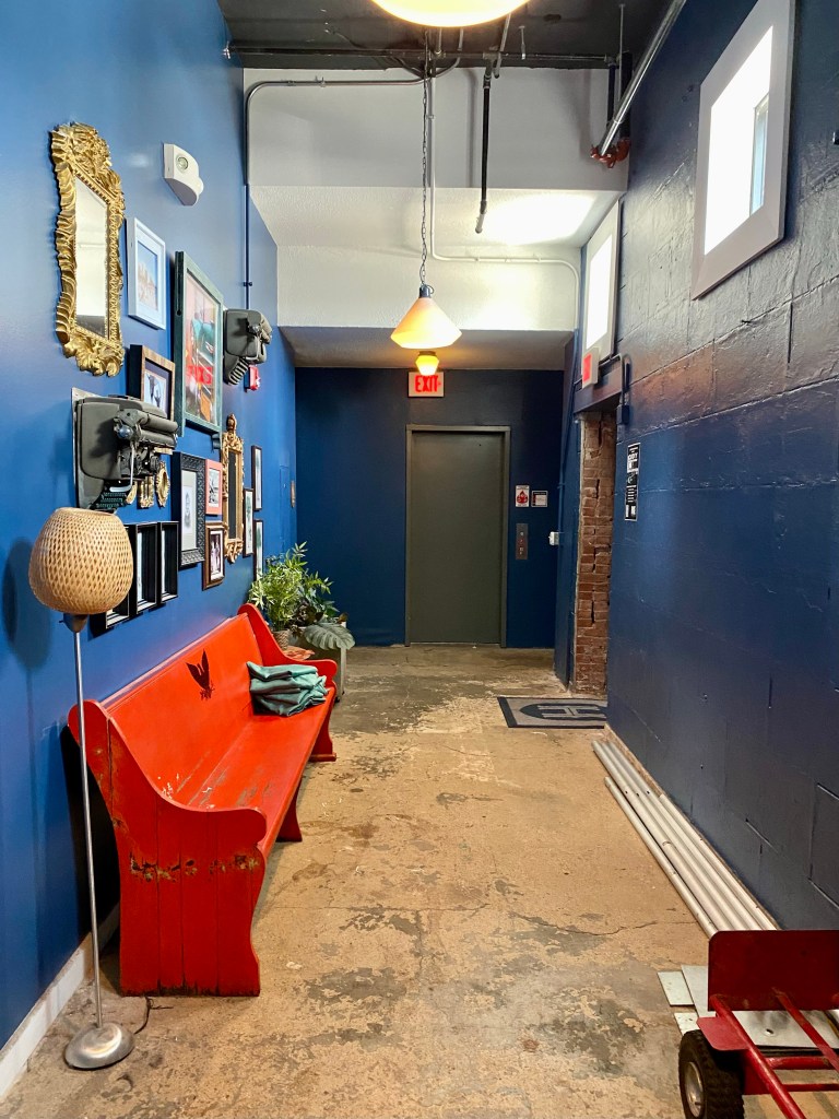 The corridor with the tribute to Hemingway along the wall on the left