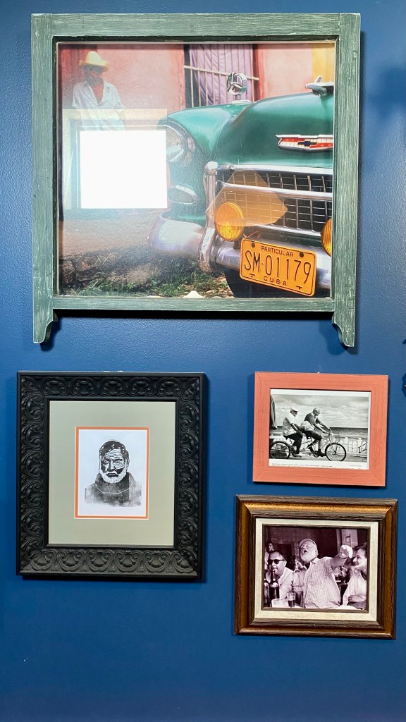 Along one of the walls in a corridor in the Hemingway Building is this small tribute to the writer consisting of typewriters attached to the wall and various photos of Hemingway and places and activities associated with him