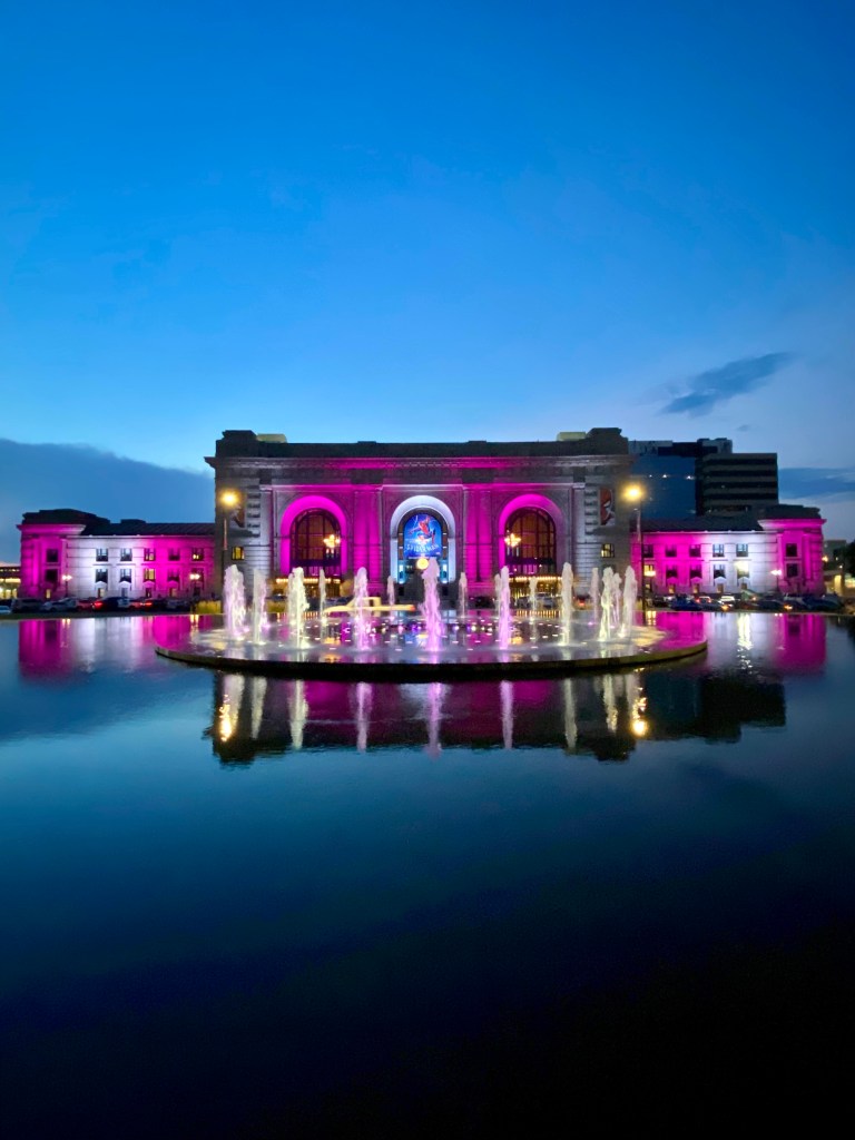Photo of Union Station and the Henry Wollman Bloch Fountain, lit up at night